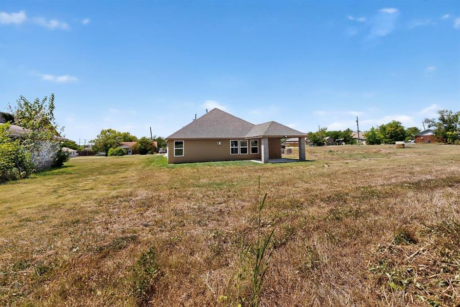 Front exterior of a new home in , Ferris, TX, highlighting curb appeal (Image 21).