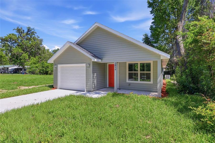 Front exterior of a new home in , Gainesville, FL, highlighting curb appeal (Image 15).