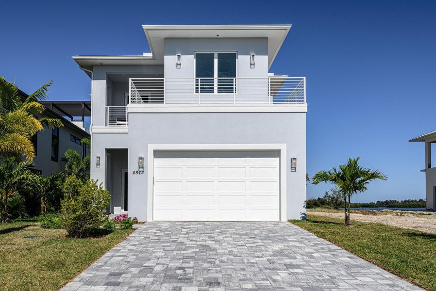 Front exterior of a new home in , Vero Beach, FL, highlighting curb appeal (Image 16).