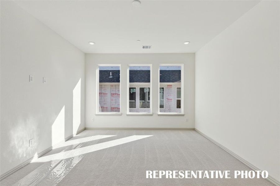 Plenty of family fun time to be enjoyed in this light filled game room!  REPRESENTATIVE PHOTO