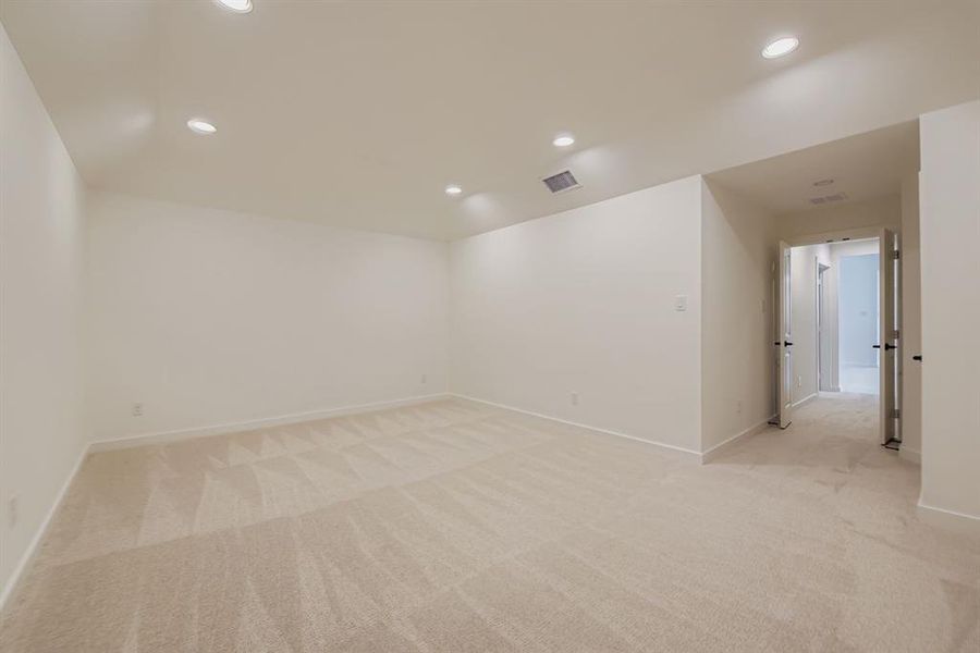 Unfurnished room featuring light colored carpet and recessed lighting Unfurnished room featuring light colored carpet and recessed lighting