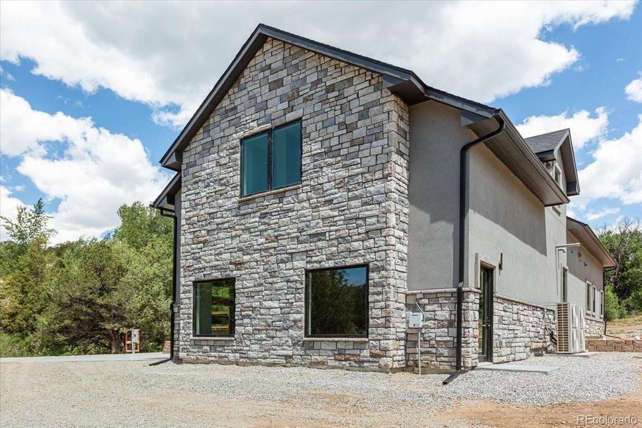 Front exterior of a new home in , Salida, CO, highlighting curb appeal (Image 2).