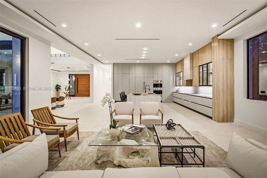 Open-Plan Family Room & Kitchen | Pivot Door | Designer Furnishings | Pinecrest FL Open-Plan Family Room & Kitchen | Pivot Door | Designer Furnishings | Pinecrest FL