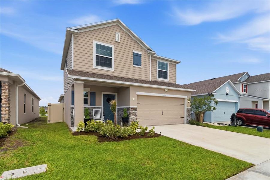 Front exterior of a new home in , St. Cloud, FL, highlighting curb appeal (Image 26).