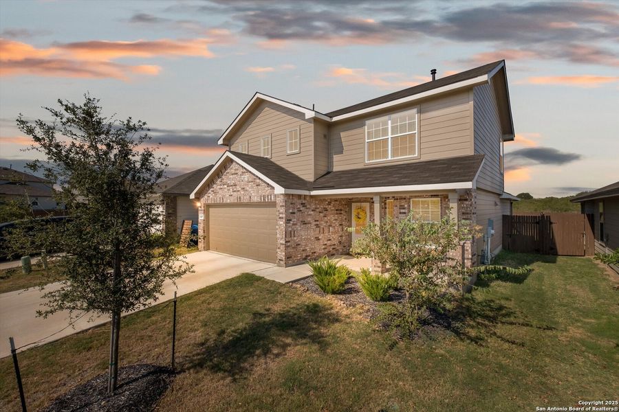 Front exterior of a new home in Avenida, Converse, TX, highlighting curb appeal (Image 2). Front exterior of a new home in Avenida, Converse, TX, highlighting curb appeal (Image 2).