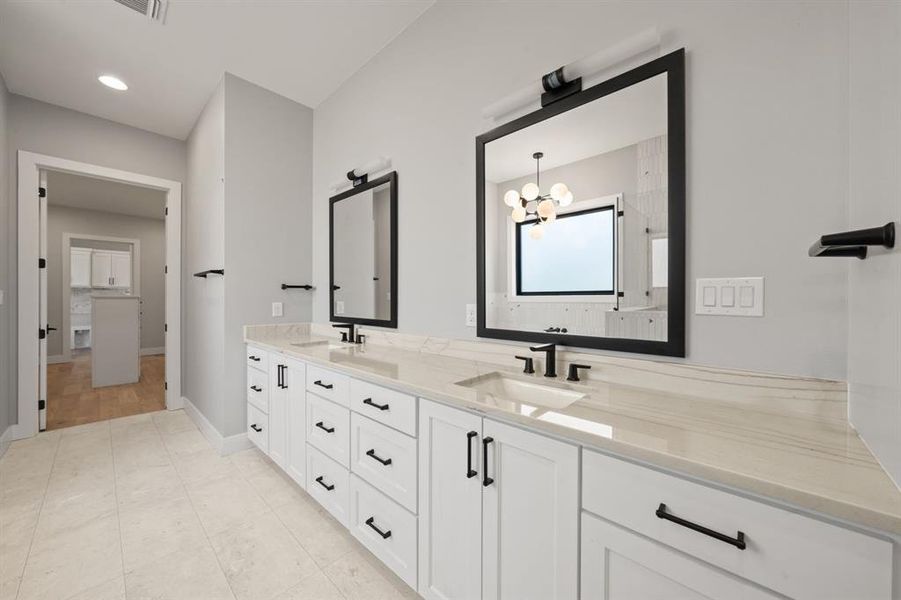 Main bathroom - double sinks and framed mirrors.