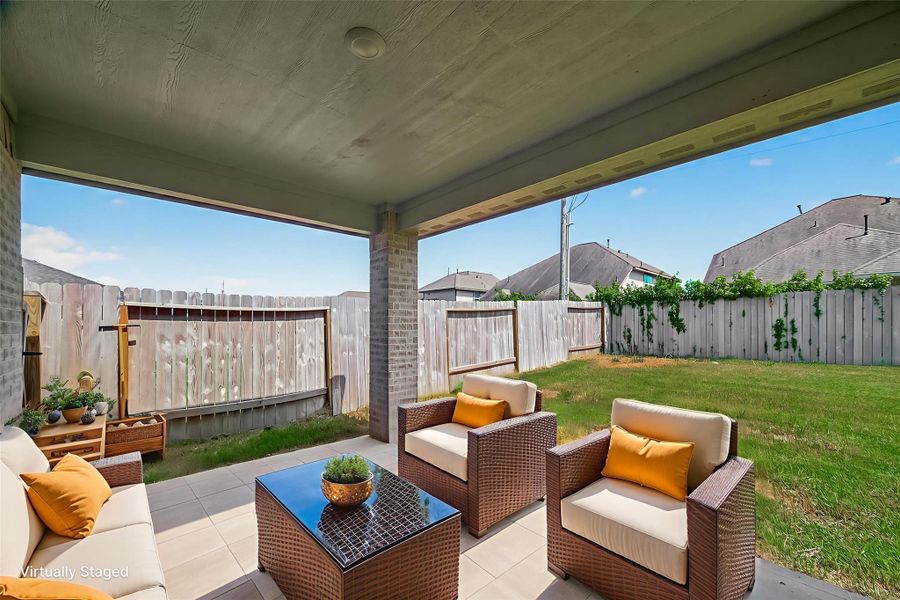 This spacious covered patio makes outdoor living a breeze. Whether you're grilling, relaxing with your morning coffee, or unwinding after a long day, it’s the perfect spot to enjoy your backyard year-round. This spacious covered patio makes outdoor living a breeze. Whether you're grilling, relaxing with your morning coffee, or unwinding after a long day, it’s the perfect spot to enjoy your backyard year-round.