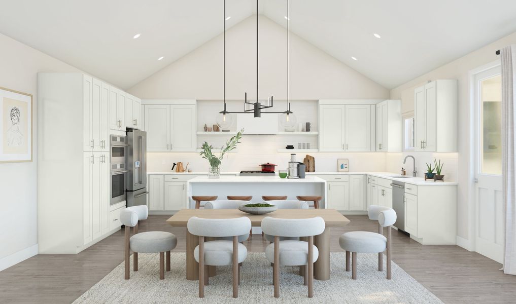 Dining area and kitchen with vaulted ceilings