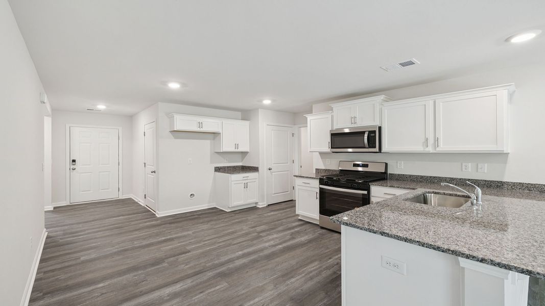 Furnished interior view inside a new home in Bentley Park, Greenwood (Image 5).