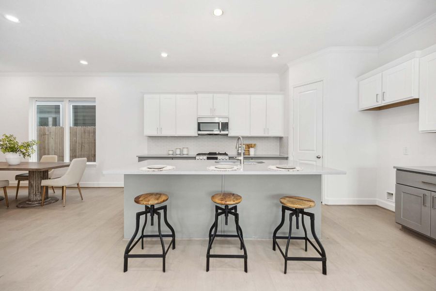 Gather here. Whether it’s Sunday waffles or weeknight catch-ups, this airy nook invites connection—and lets the kitchen shine as the heart of the home. Gather here. Whether it’s Sunday waffles or weeknight catch-ups, this airy nook invites connection—and lets the kitchen shine as the heart of the home.