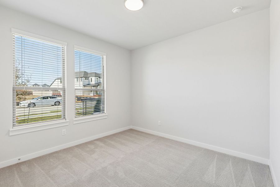 Bedroom in the Masters home plan by Trophy Signature Homes – REPRESENTATIVE PHOTO