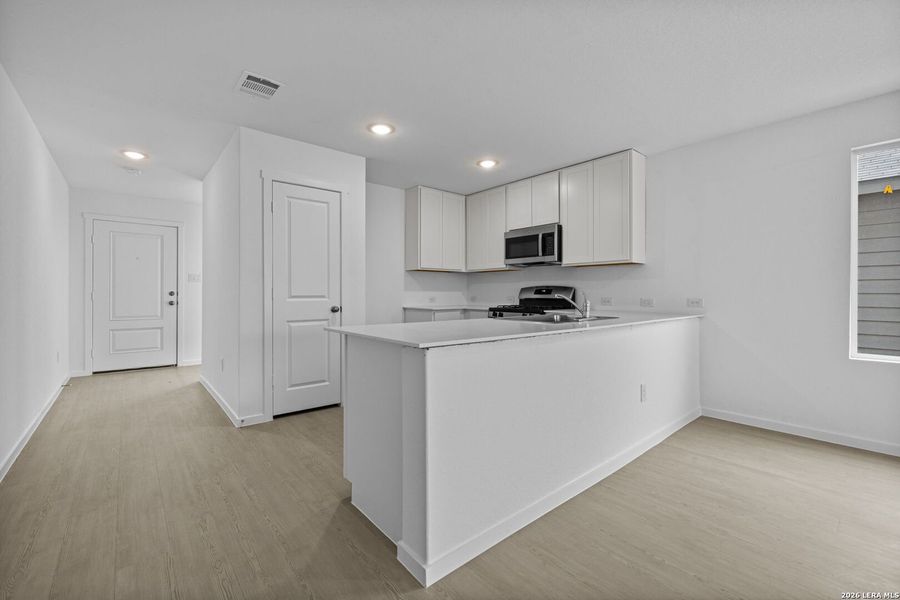 Furnished interior view inside a new home in Voss Farms, New Braunfels (Image 7).