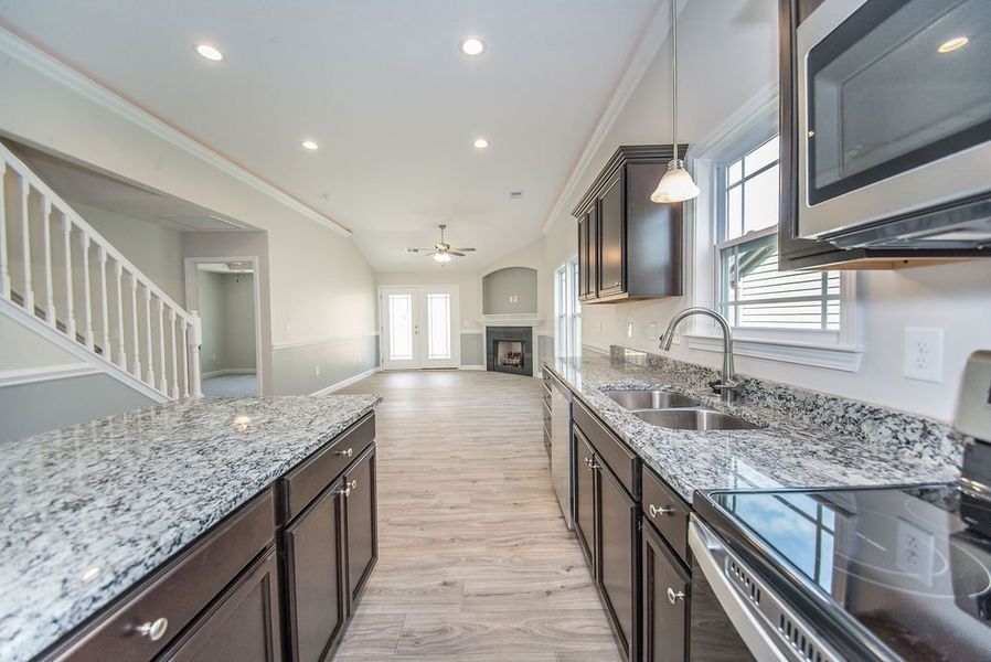Representative furnished interior of a home built from the Quincy by Enchanted Homes in Lonesome Dove, San Antonio (Image 14).