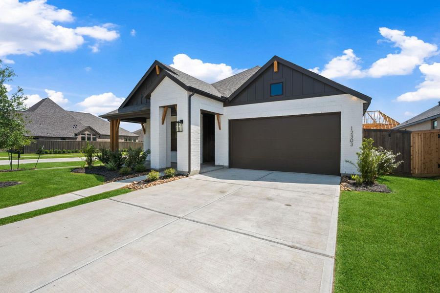 Front exterior of a new home in Riceland: 50ft. lots, Mont Belvieu, TX, highlighting curb appeal (Image 20). Front exterior of a new home in Riceland: 50ft. lots, Mont Belvieu, TX, highlighting curb appeal (Image 20).