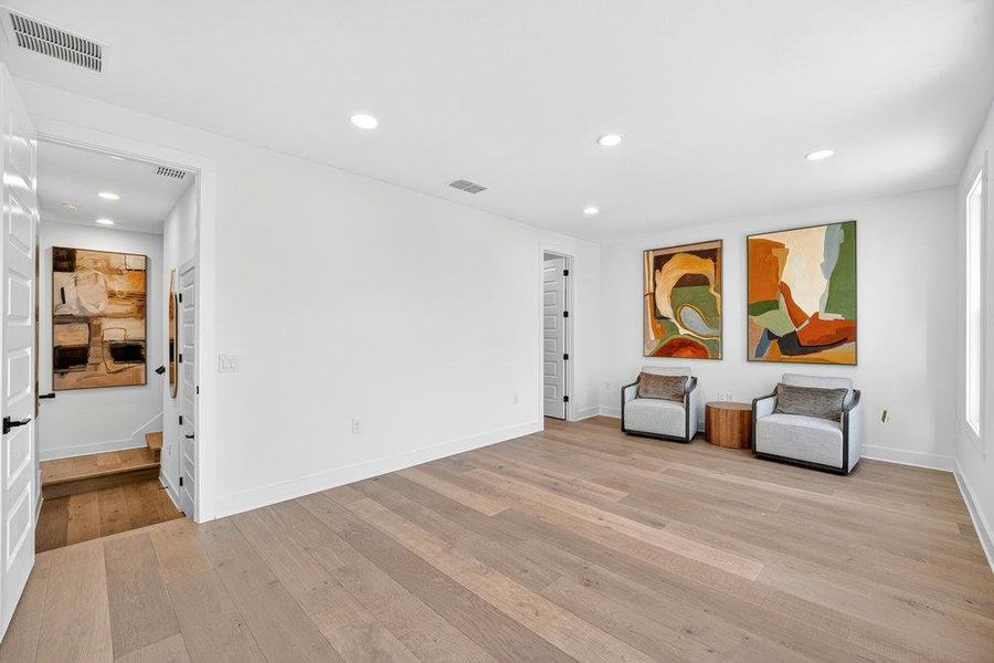 Unfurnished room featuring light wood-type flooring and recessed lighting