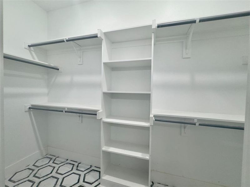 Walk in closet featuring tile flooring