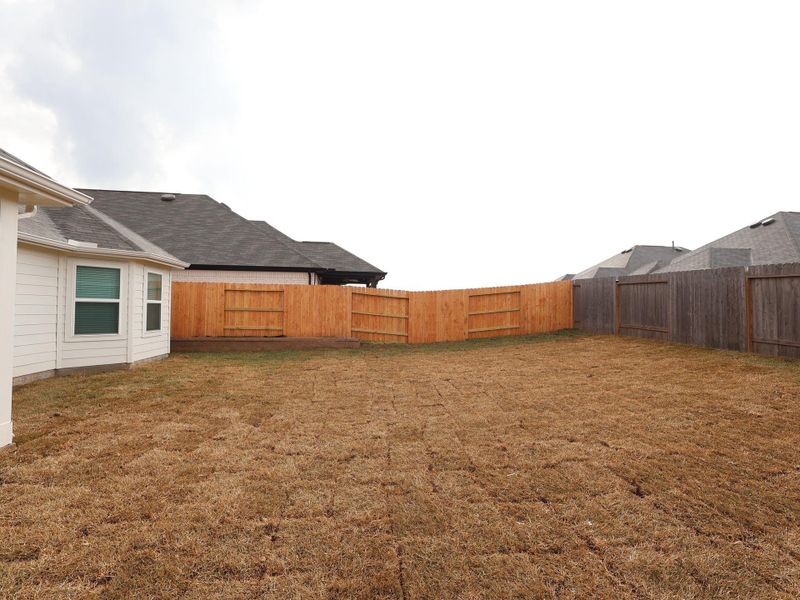 Exterior details and patio area of a home in Magnolia Ridge, Magnolia (Image 15).