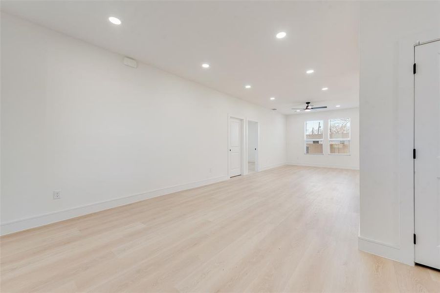 Spare room with ceiling fan and light hardwood / wood-style flooring