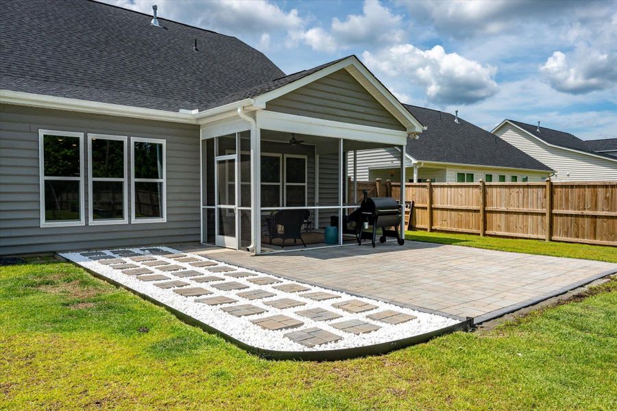 Exterior details and patio area of a home in The Enclave at French Quarter Creek, Huger (Image 23).