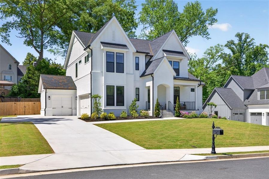 Front exterior of a new home in Town Farms, Peachtree Corners, GA, highlighting curb appeal (Image 27).