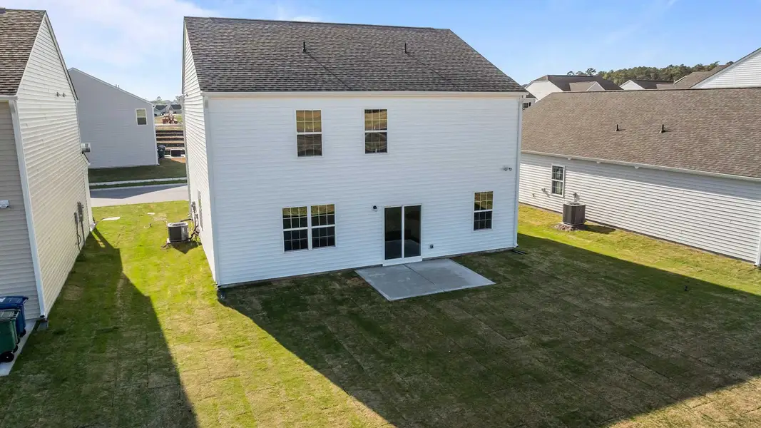 Exterior details and patio area of a home in Ridgewood Farms, Winterville (Image 3).