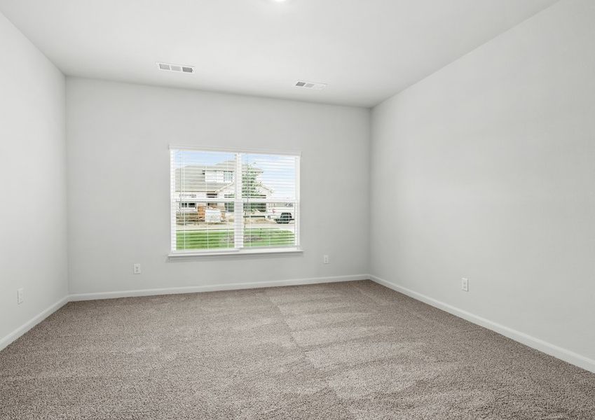 The master bedroom has a large window that lets in great, natural light and back yard views.