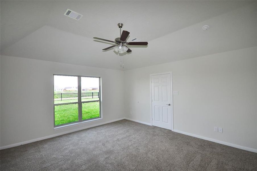 Located in the rear, the master bedroom has a view out to the lake.