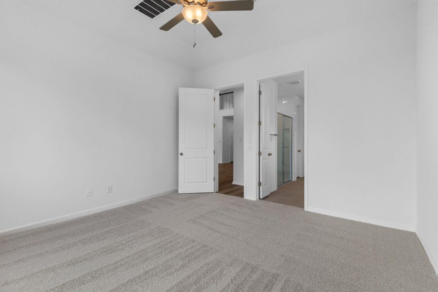 Primary Bedroom with elevated ceiling Primary Bedroom with elevated ceiling