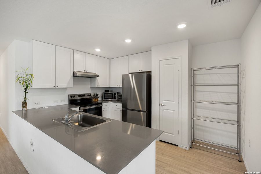 Furnished interior view inside a new home in Mission del Lago, San Antonio (Image 12).