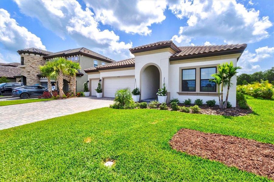 Front exterior of a new home in Crosswind Ranch, Parrish, FL, highlighting curb appeal (Image 30).