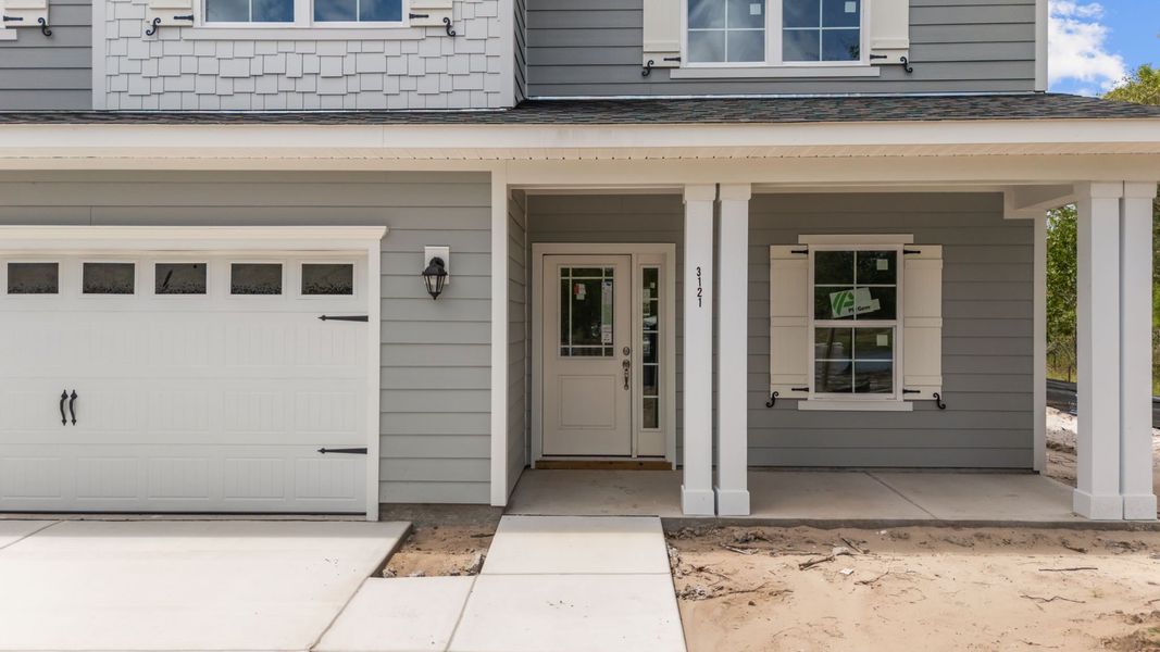 Front exterior of a new home in Rutledge, Shallotte, NC, highlighting curb appeal (Image 2).