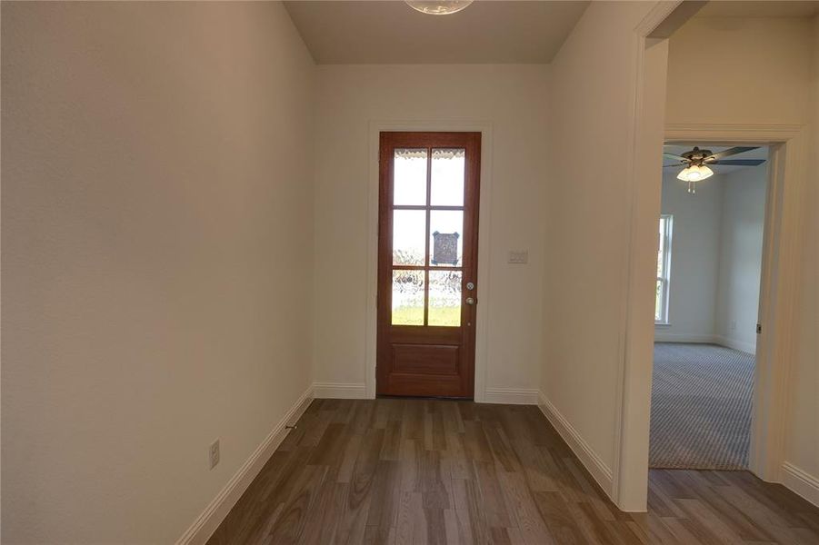 Doorway with wood finished floors Doorway with wood finished floors