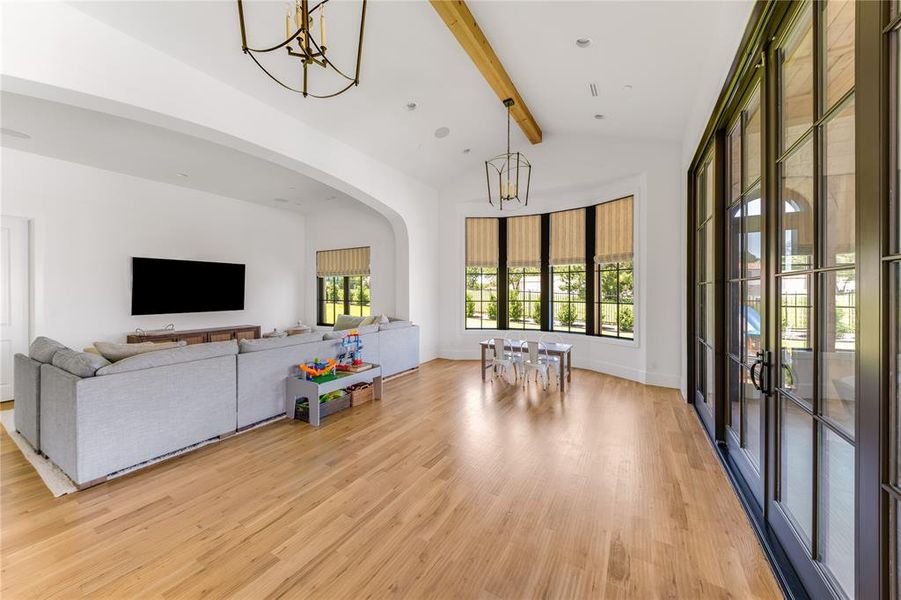 Second living room downstairs makes a great entertaining space with a wall of doors to the patio