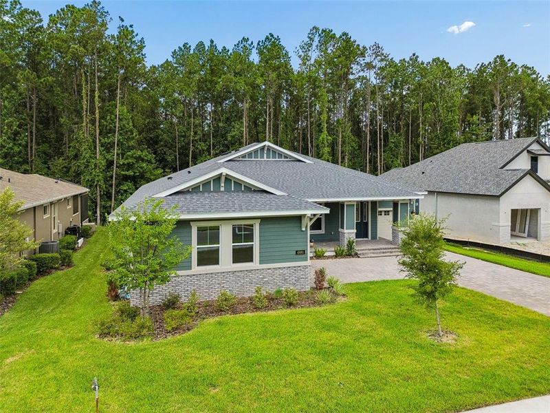Front exterior of a new home in Southern Hills Plantation, Brooksville, FL, highlighting curb appeal (Image 28). Front exterior of a new home in Southern Hills Plantation, Brooksville, FL, highlighting curb appeal (Image 28).