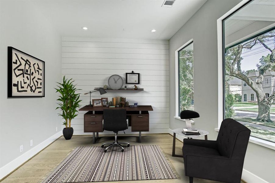 Great open study with an abundance of natural light from the large windows.  Please note the great accent wall.