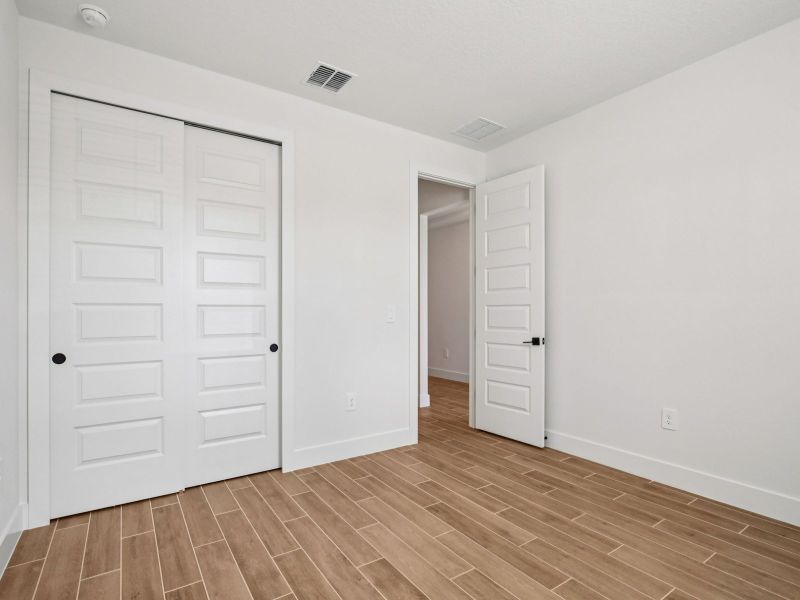Spacious, unfurnished interior of a new home in Magnolia Bay - Reserve Series, Nokomis (Image 13).