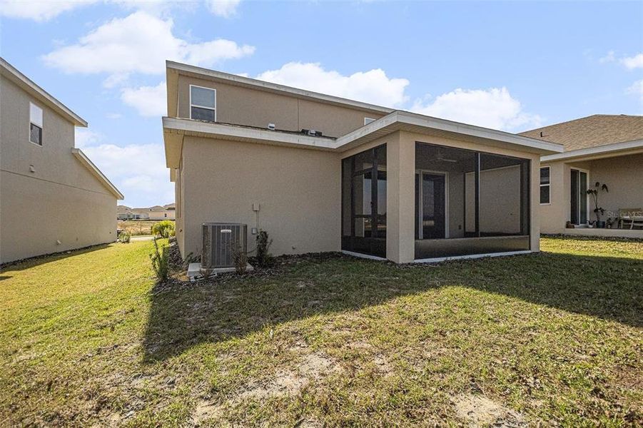 Exterior details and patio area of a home in Hills of Minneola, Minneola (Image 3).