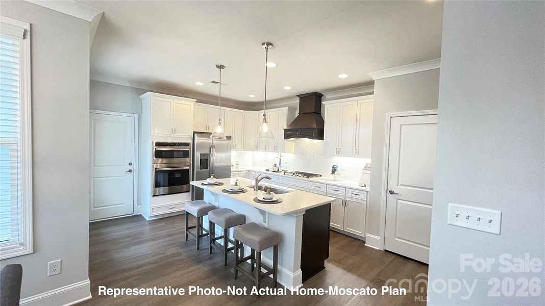 Kitchen with wall oven, upgraded range hood-Moscato Plan