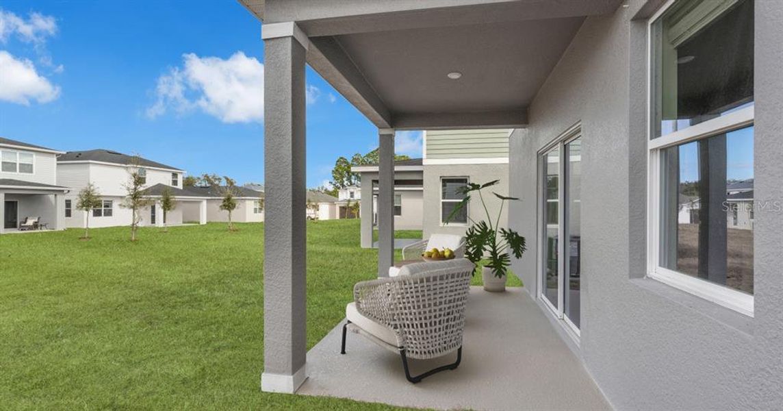 Exterior details and patio area of a home in Avalon Park Tavares Single Family Homes, Tavares (Image 28).