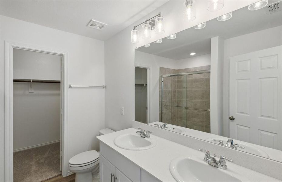 Spacious owner's bath with dual vanity *real home pictured