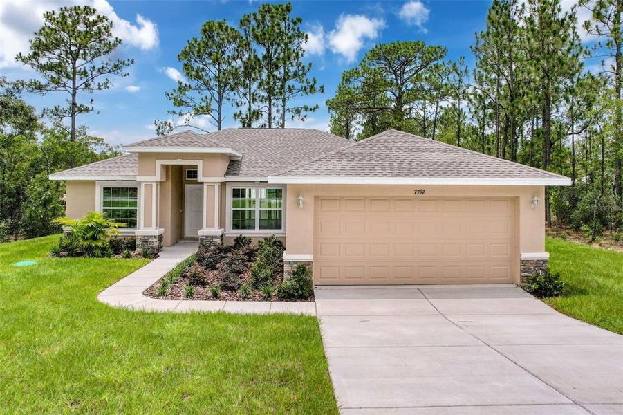 Front exterior of a new home in , Dunnellon, FL, highlighting curb appeal (Image 23).