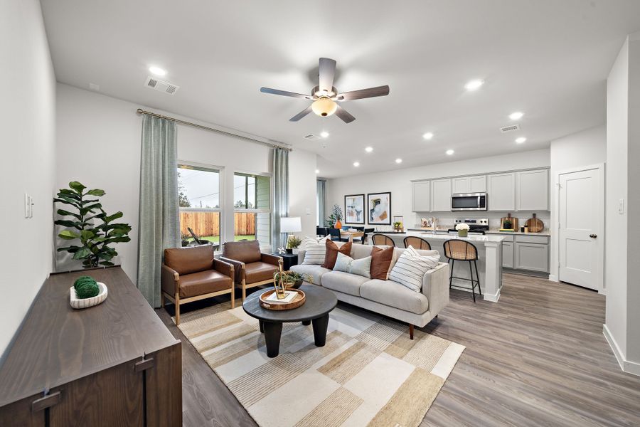 A living room with a large window. A living room with a large window.