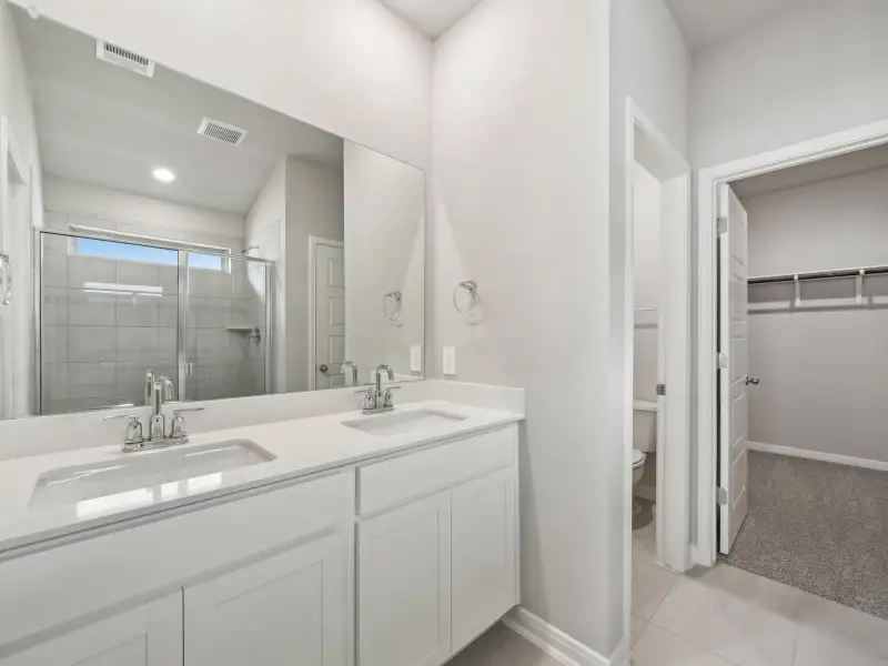 Primary suite bathroom in the Briscoe floorplan at a Meritage Homes community. Primary suite bathroom in the Briscoe floorplan at a Meritage Homes community.