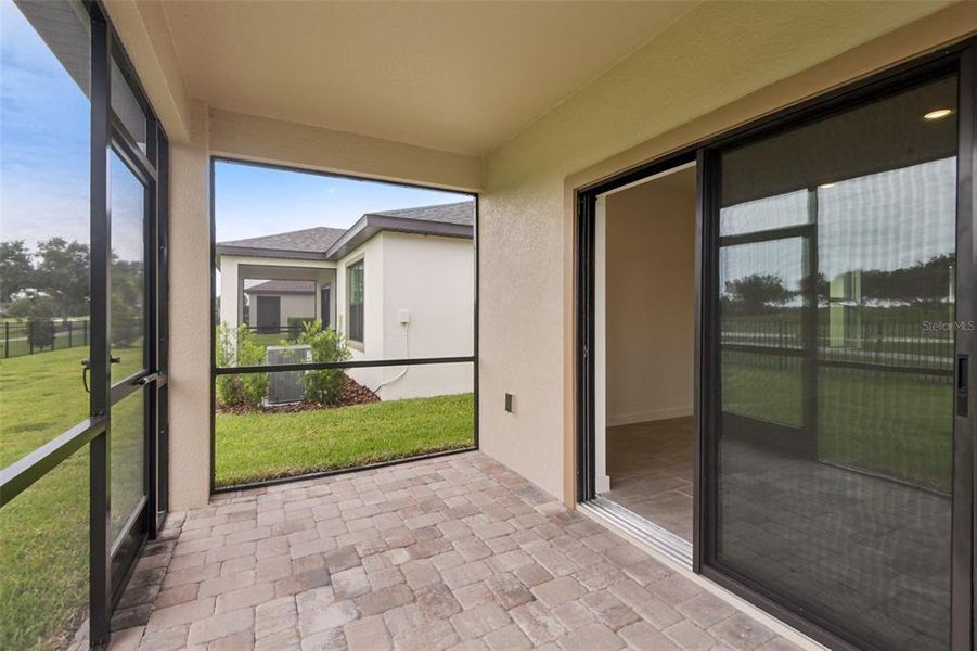 Exterior details and patio area of a home in Grasslands West, Lakeland (Image 19).