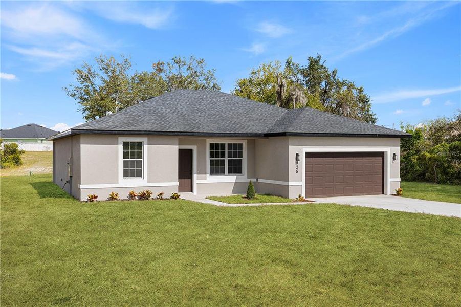 Front exterior of a new home in , Poinciana, FL, highlighting curb appeal (Image 20).