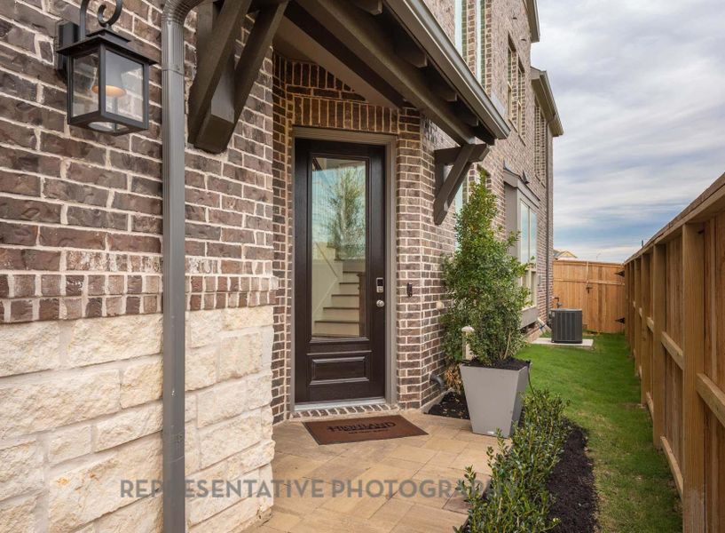 Exterior details and patio area of a home in Bridgeland Central: The Cottages, Cypress (Image 1).