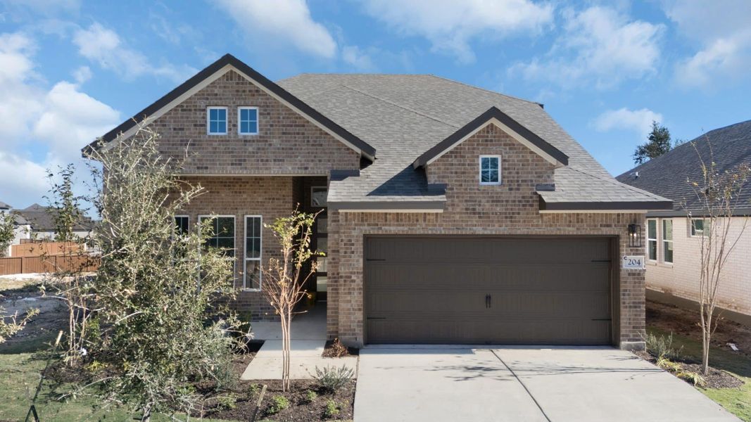 Front exterior of a new home in Highland Village, Georgetown, TX, highlighting curb appeal (Image 18).