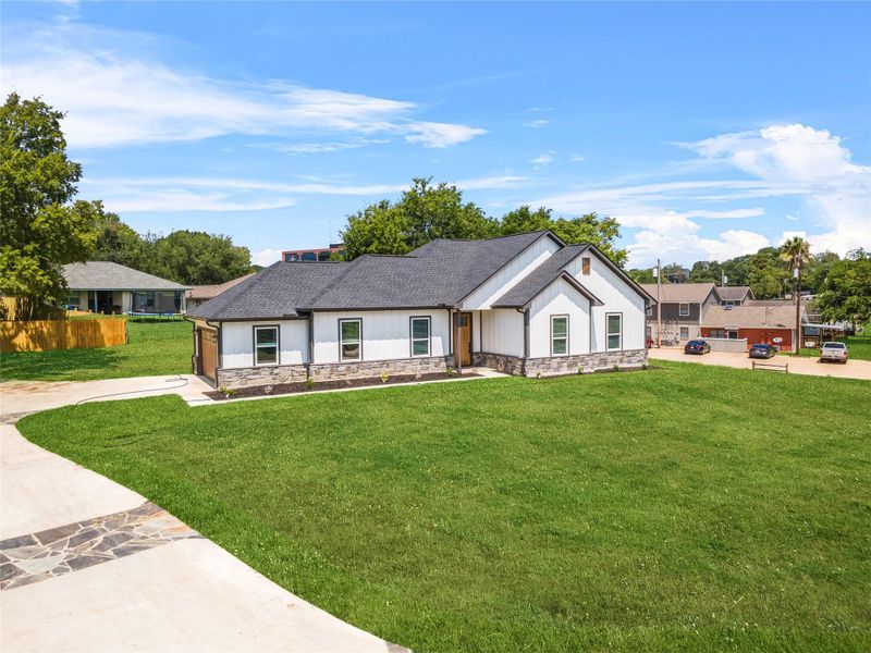 Front exterior of a new home in , Brenham, TX, highlighting curb appeal (Image 2). Front exterior of a new home in , Brenham, TX, highlighting curb appeal (Image 2).