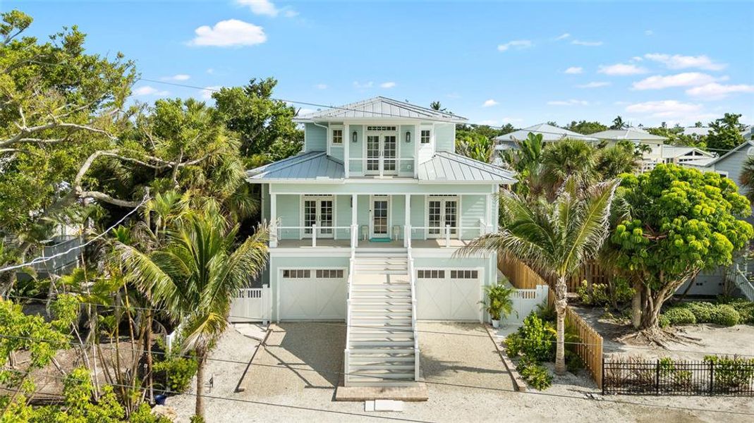 Front exterior of a new home in , Boca Grande, FL, highlighting curb appeal (Image 24). Front exterior of a new home in , Boca Grande, FL, highlighting curb appeal (Image 24).