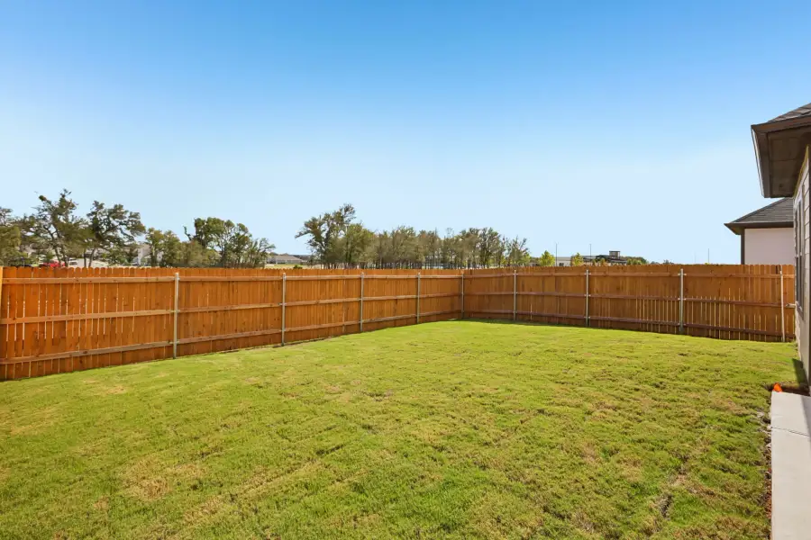 Exterior details and patio area of a home in Trinity Ranch, Elgin (Image 22).